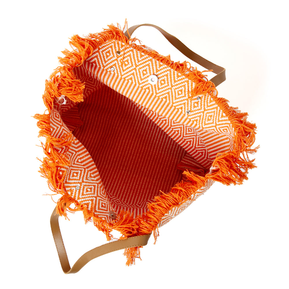 The orange Woven Beach Bag made from woven cotton with a contrasting brown faux leather strap 